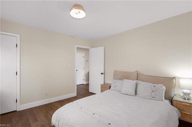 bedroom featuring dark hardwood / wood-style floors