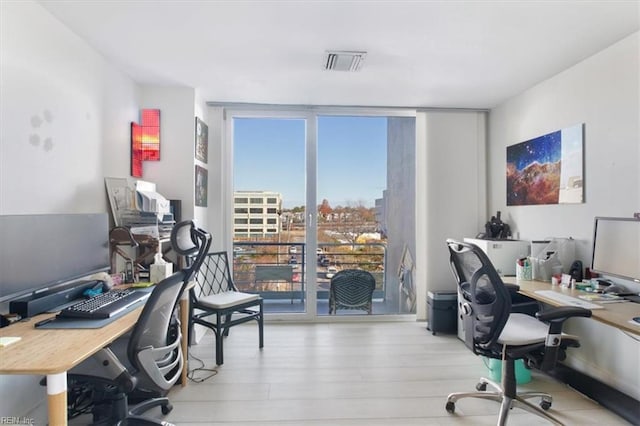 office space featuring light hardwood / wood-style floors