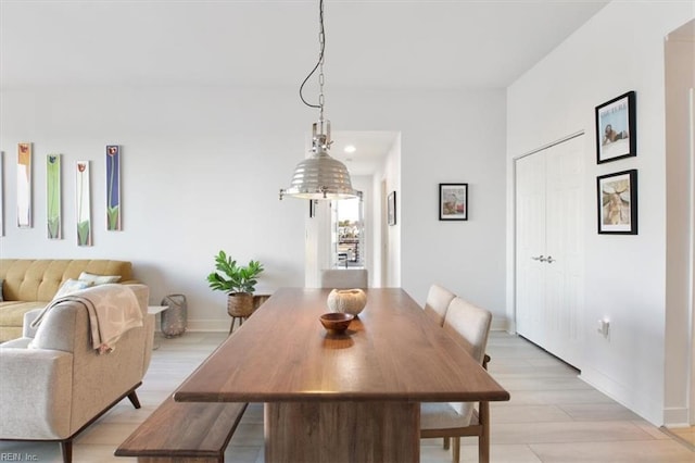 dining area with light hardwood / wood-style flooring