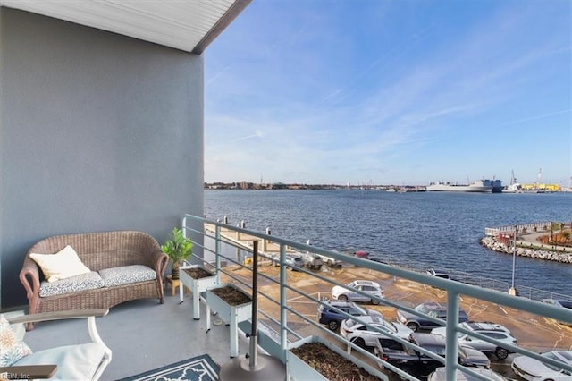 balcony featuring a water view