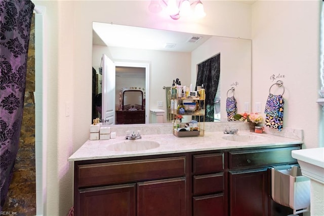 bathroom with a shower and vanity