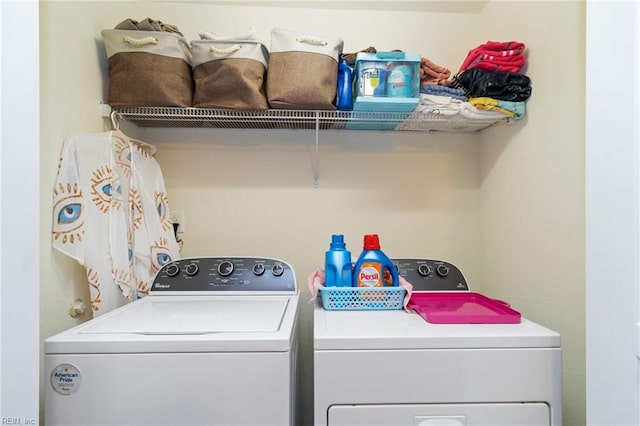 washroom featuring washer and clothes dryer