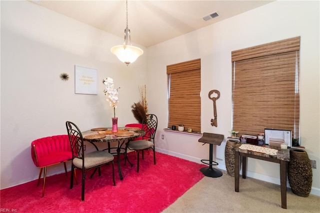 dining room with carpet floors