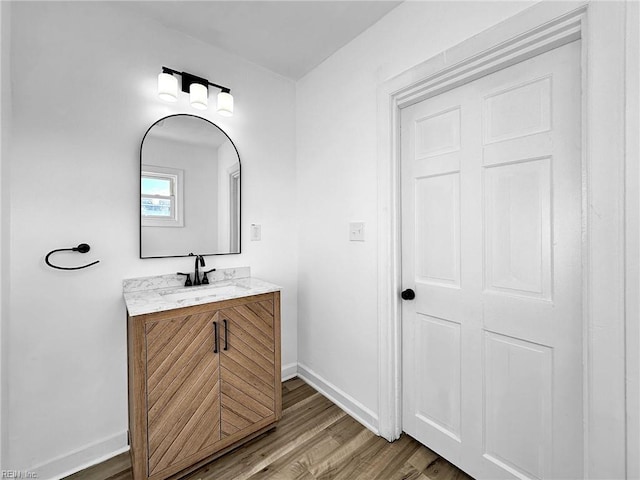 bathroom with vanity and wood-type flooring