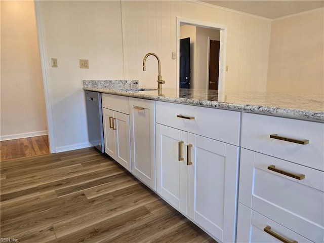 bathroom with hardwood / wood-style flooring and sink