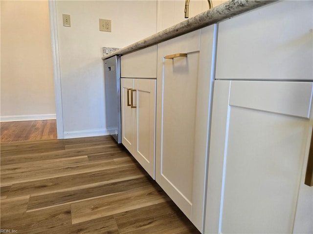 interior details featuring hardwood / wood-style flooring