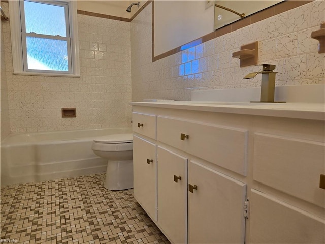 full bathroom featuring vanity, backsplash, washtub / shower combination, toilet, and tile walls