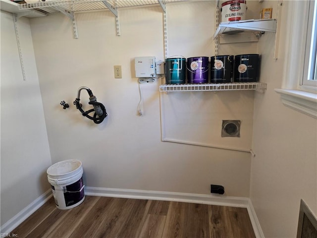 laundry area featuring hookup for an electric dryer, washer hookup, and dark hardwood / wood-style floors