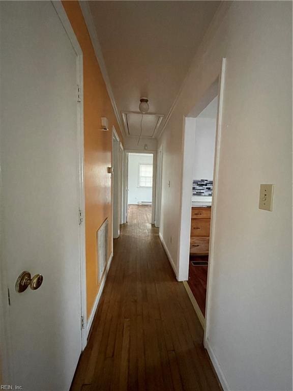 hall with crown molding and dark wood-type flooring