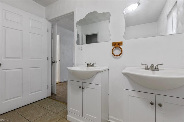 bathroom with tile patterned flooring and vanity