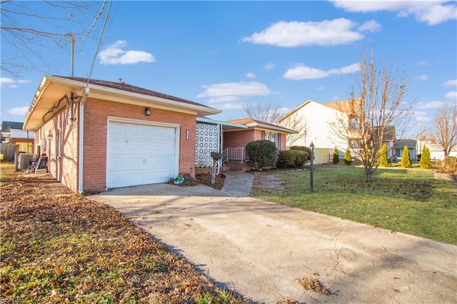 view of front of house with a garage and a front yard