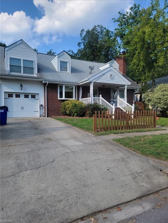 view of front of property featuring a garage and a front yard