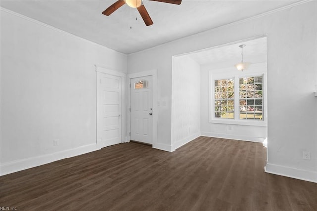 spare room featuring dark hardwood / wood-style flooring and ceiling fan