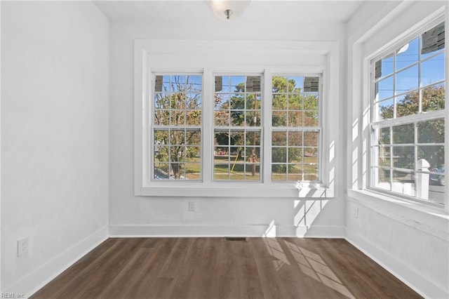 unfurnished sunroom featuring a healthy amount of sunlight