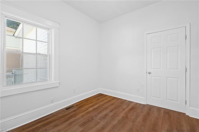 empty room with wood-type flooring