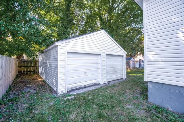 garage featuring a lawn