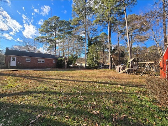 view of yard with a playground