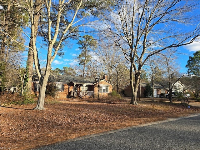 ranch-style home featuring a porch