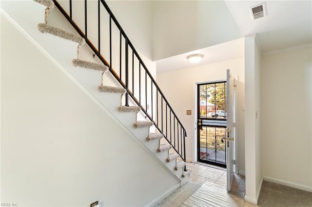 foyer with light carpet