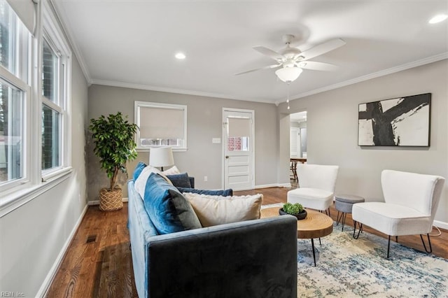 living room with ceiling fan, dark wood-type flooring, and ornamental molding