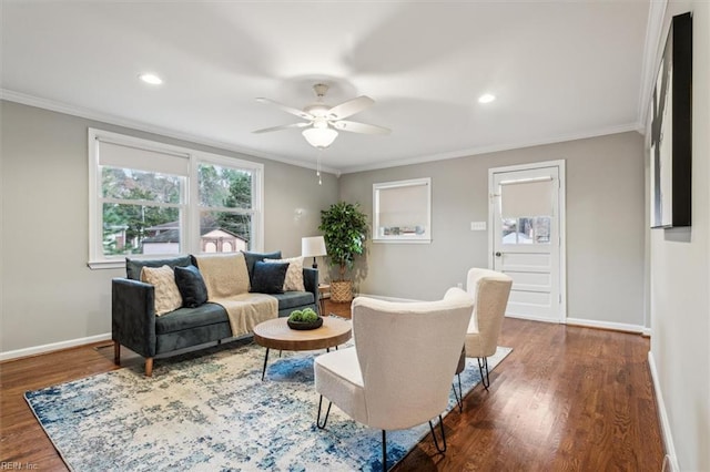 living room featuring dark hardwood / wood-style flooring, ceiling fan, and crown molding