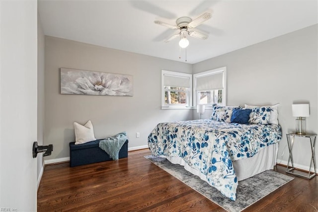 bedroom with ceiling fan and dark hardwood / wood-style floors