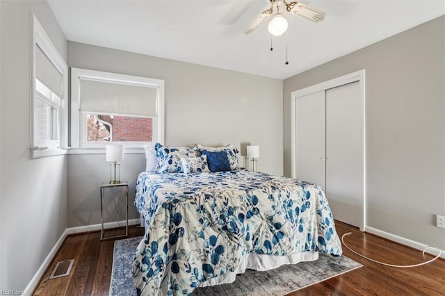 bedroom featuring a closet, ceiling fan, and dark wood-type flooring