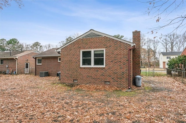 view of home's exterior with central AC unit