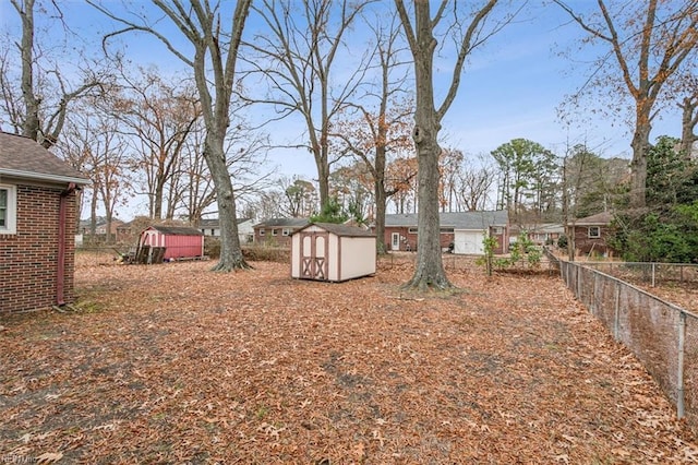 view of yard with a storage unit