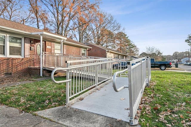 view of side of property with a lawn