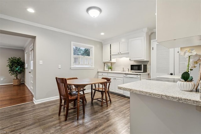 kitchen with dishwasher, dark hardwood / wood-style floors, and white cabinetry