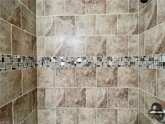 details featuring a tile shower