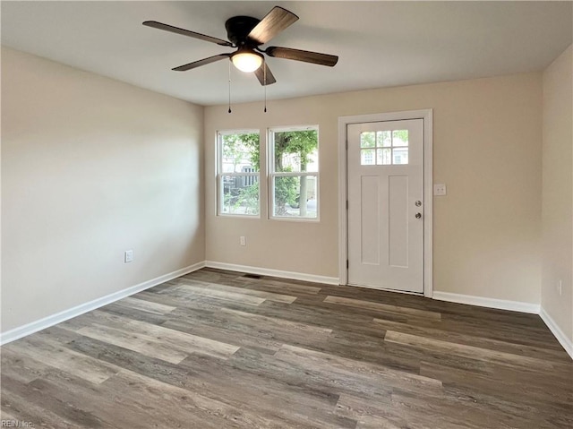 foyer with ceiling fan and dark hardwood / wood-style flooring