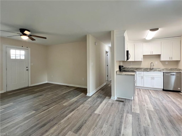 kitchen featuring ceiling fan, white cabinets, stainless steel appliances, and light hardwood / wood-style floors