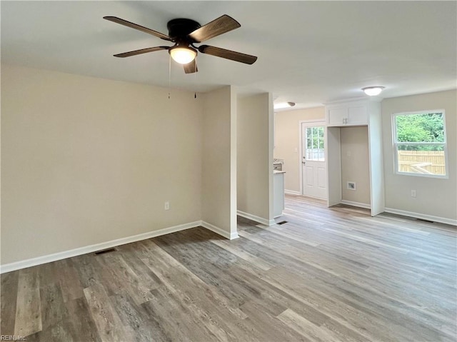 unfurnished room featuring ceiling fan and light hardwood / wood-style flooring