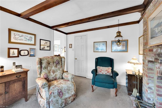 living area with beam ceiling and light colored carpet