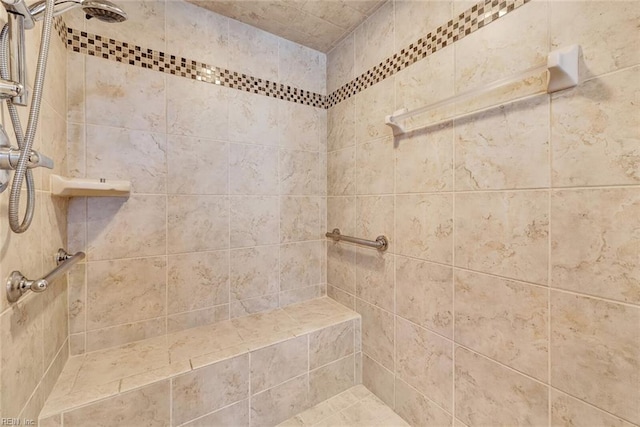 bathroom with tiled shower