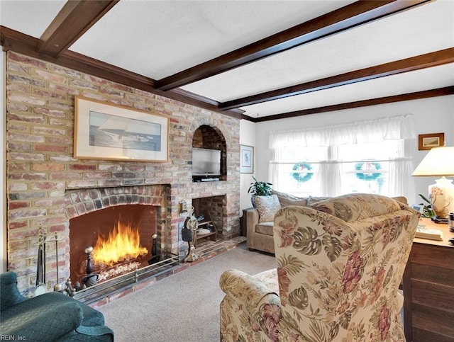 living room featuring beamed ceiling and a brick fireplace