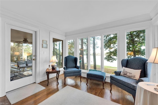 sunroom featuring ceiling fan