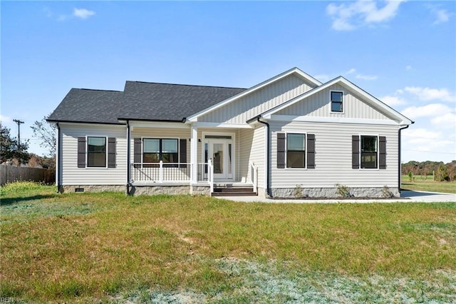 view of front of house featuring covered porch and a front yard