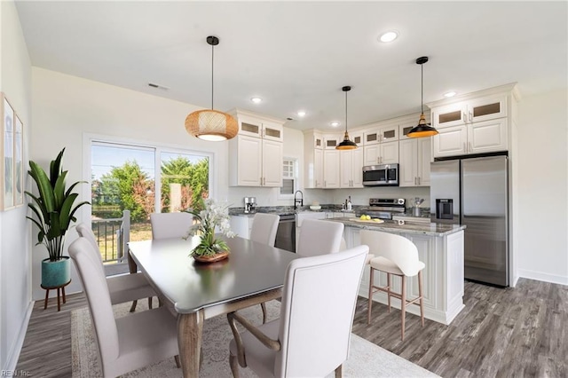 dining space featuring hardwood / wood-style flooring