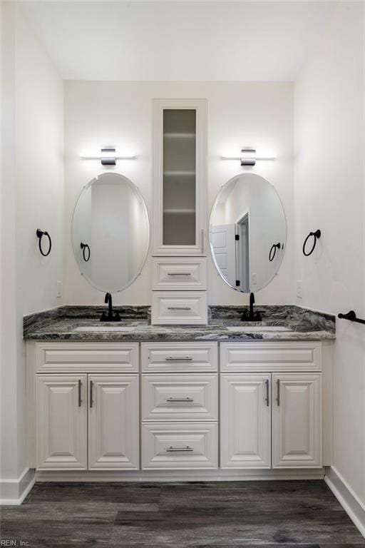 bathroom featuring hardwood / wood-style floors and vanity