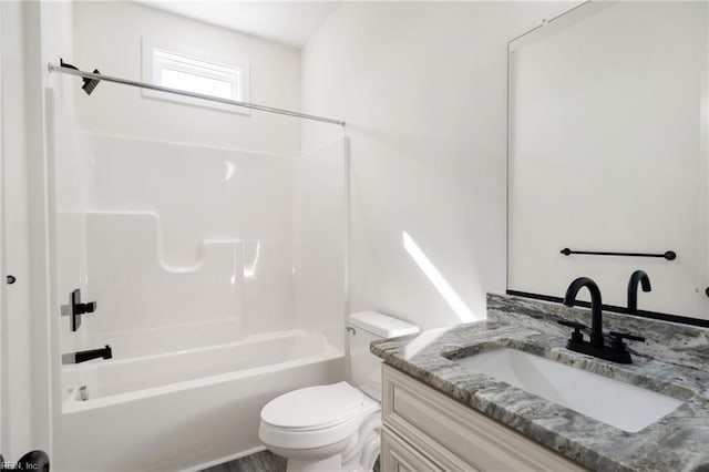 full bathroom with shower / tub combination, vanity, and toilet