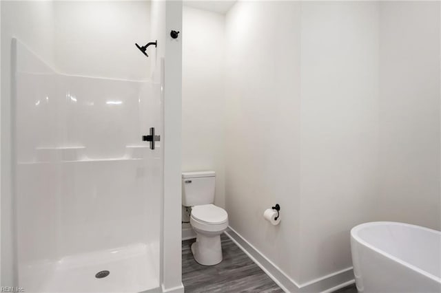 bathroom with plus walk in shower, wood-type flooring, and toilet