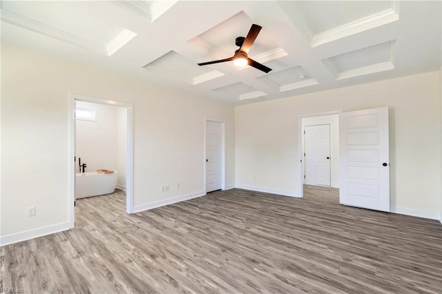 unfurnished bedroom featuring beam ceiling, connected bathroom, ceiling fan, coffered ceiling, and light hardwood / wood-style floors