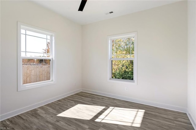 spare room featuring dark hardwood / wood-style floors