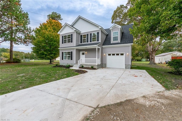 view of front of house featuring a front yard and a garage