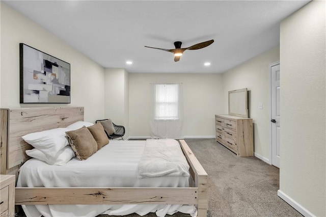 bedroom with ceiling fan and light colored carpet