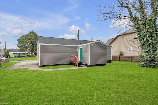 rear view of house with a lawn