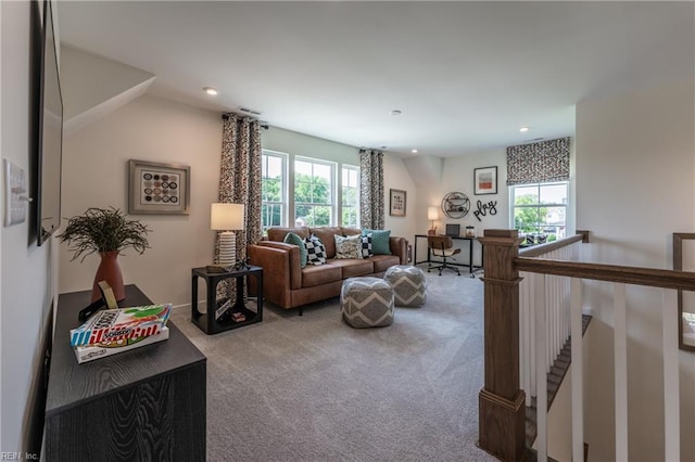 carpeted living room featuring a healthy amount of sunlight